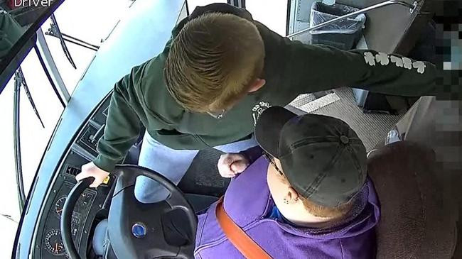 dillon reeves grabs the steering wheel on his school bus