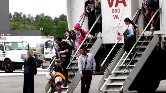 dozens of white south africans land in us