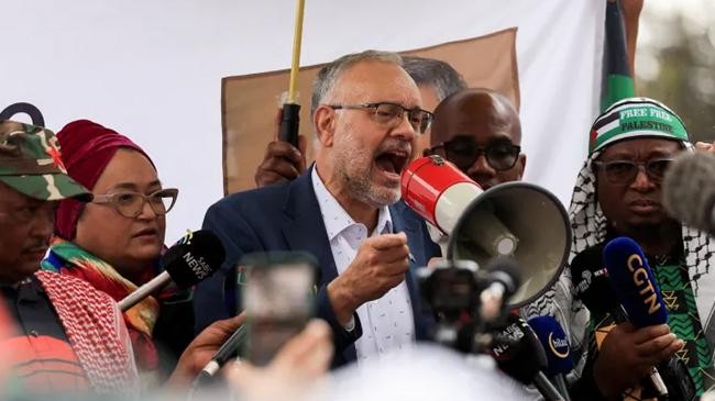 ebrahim rasool speaks upon his arrival at the airport