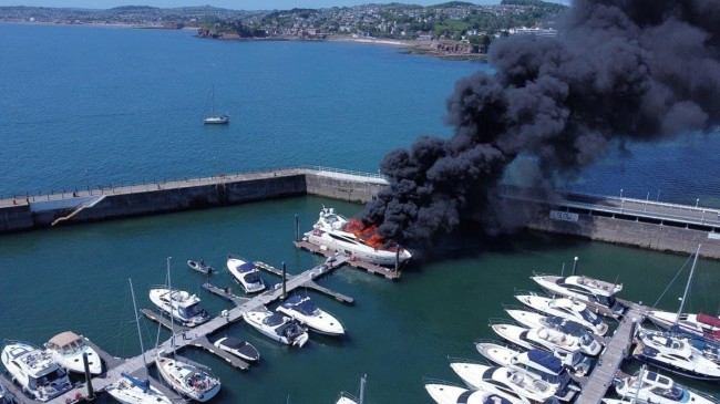 fire engulfs superyacht in british marina