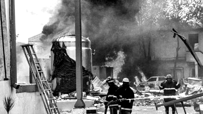 firefighters try to extinguish a fire