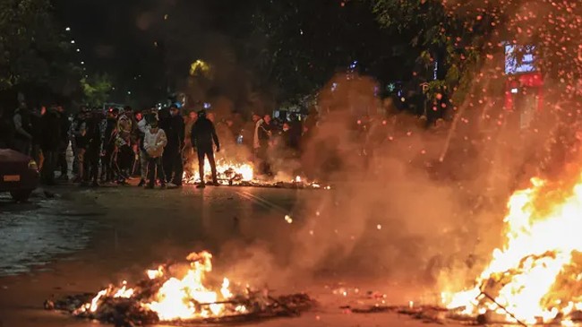 fires burning on road outside hospital in thessaloniki