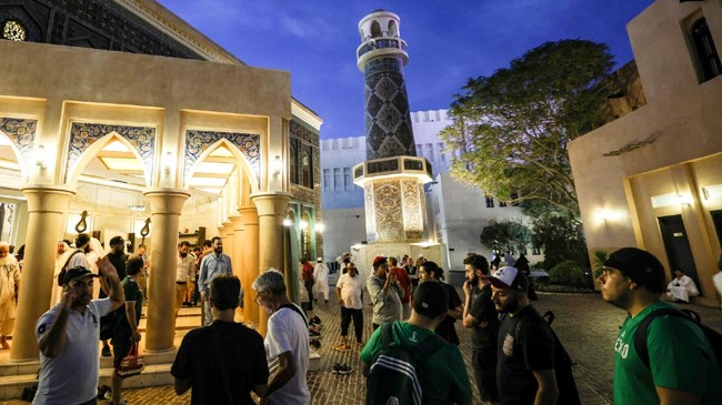 football fans and local residents visit dohas blue mosque