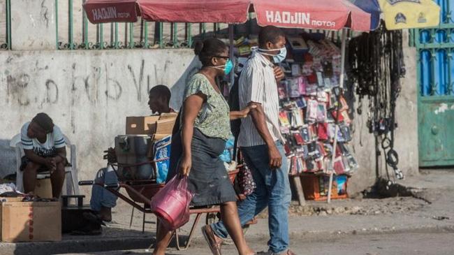 haitian people walking in street