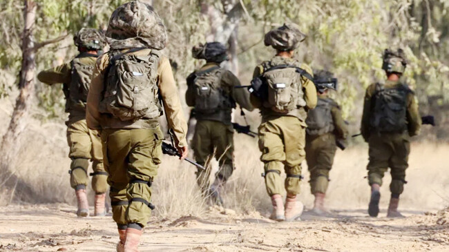 israeli army soldiers patrol in gaza strip