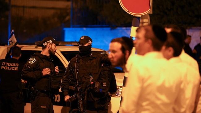 israeli security personnel gather in the area where 3 people were killed