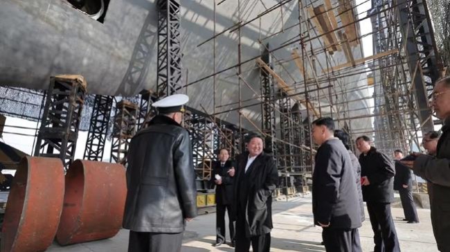 kim jong un visits a shipyard building nuclear powered submarines