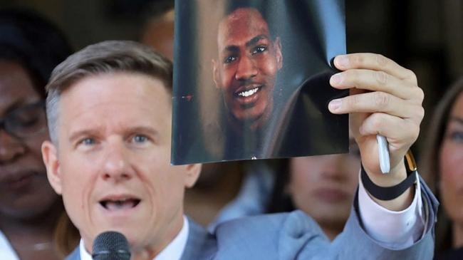 lawyer bobby dicello holds up a photograph of jayland walker