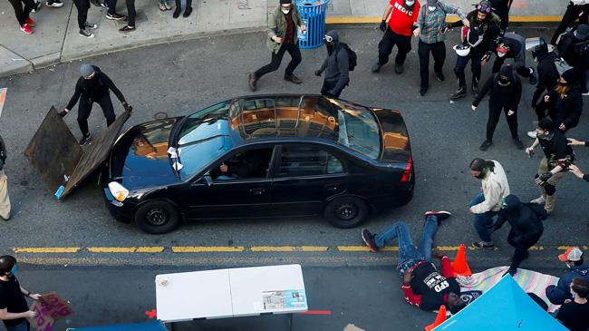 man drives car into george floyd protest crowd