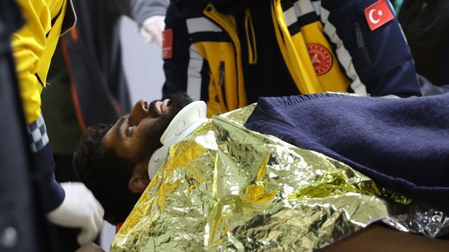 mustafa avci is seen on a stretcher after being rescued