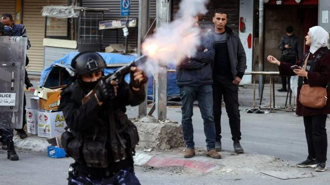 pa security forces use tear gas to disperse a protest