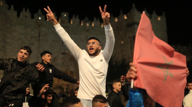 palestinians celebrating morocco world cup win in jerusalem