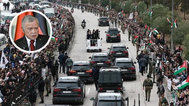 people wave flags on the road leading to ammans marka airport 1