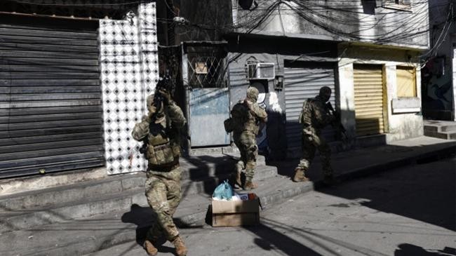 police officers take positions during the operation