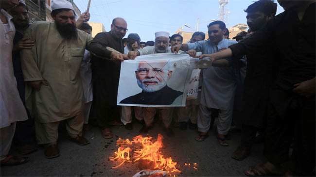 protester burning modis pic