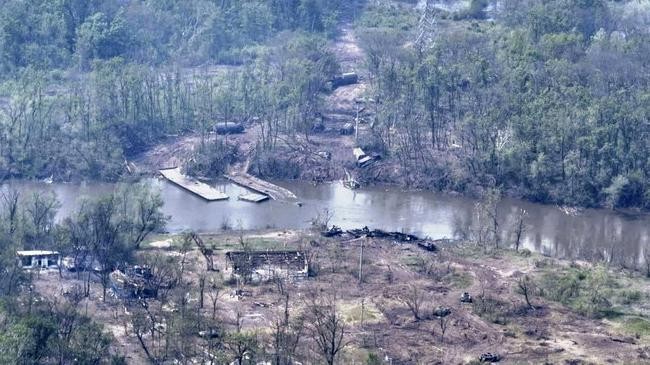 russian armored vehicles are strewn on the banks of donets river
