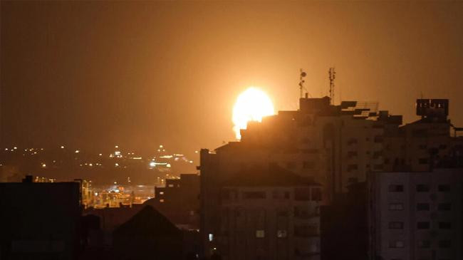 smoke and flames rise above buildings after israeli air airstrikes in gaza city on july 5 2023