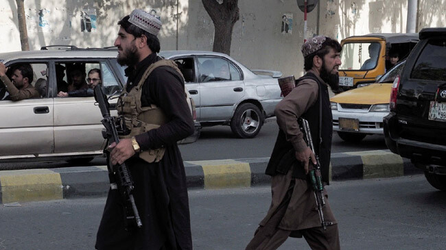 taliban members petroling afghanistan