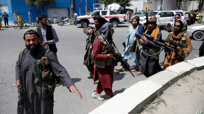 taliban members petrolling kabul