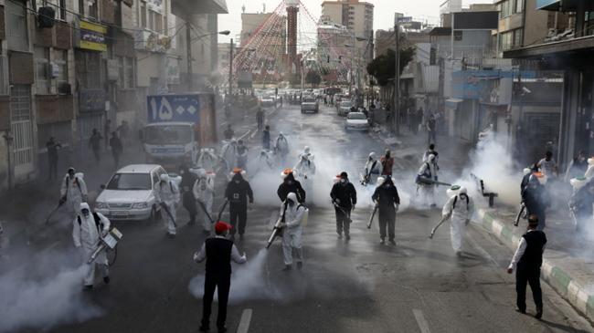 tehran police giving sanitizer