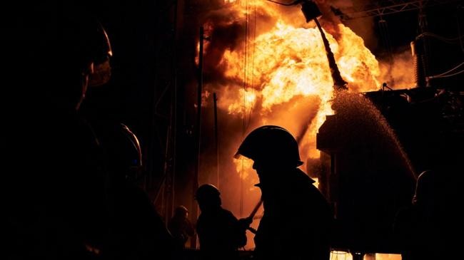 ukrainian firefighters put out a fire at a power station