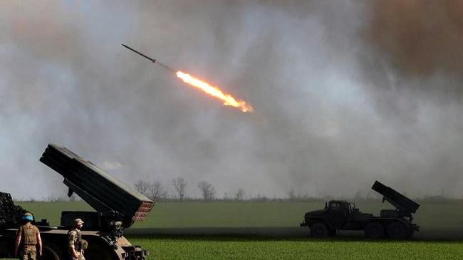 ukrainian servicemen fire with a bm 21 grad multiple rocket launch system