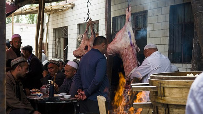 uyghur eating pork