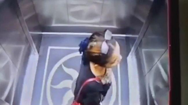woman falls down airport elevator